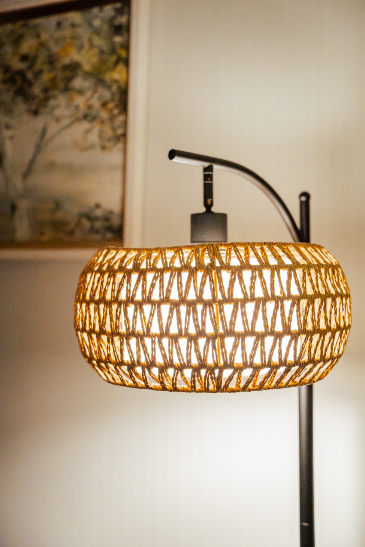 Woven rattan lamp casting warm light in a calm therapy office